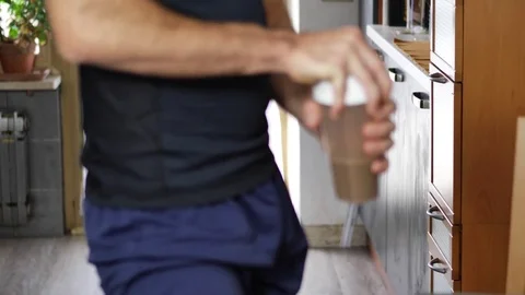 Young man drinking a smoothie drink or a protein shake Stock Footage 81175455