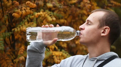 Young man drinking water after workout at the gym Video stock 68207233