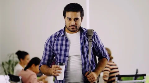 The young man drinks and smiled with satisfaction Stock Footage 98226295