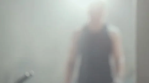 Young man drinks water and does push-ups with dumbbells in the gym Stock Footage 48993256