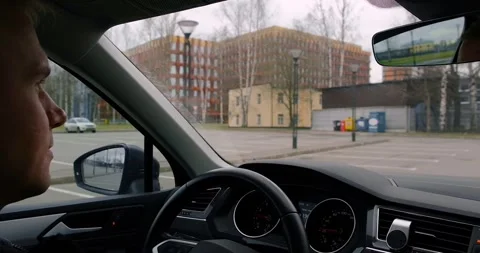 A young man driver in is driving a car. Stock Footage 274092354