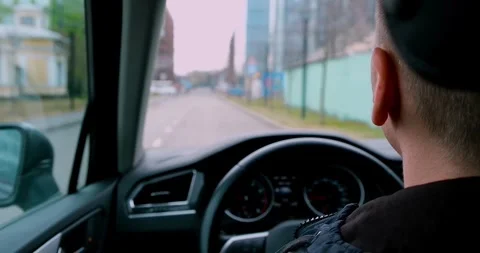A young man driver in is driving a car. Stock Footage 274092999