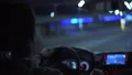 The young man drives an automobile on the night city road 4k or 4k+ Resolution