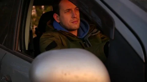 A young man drives a car with an open window. slow motion, 1920x1080, full hd Stock Footage 82296918