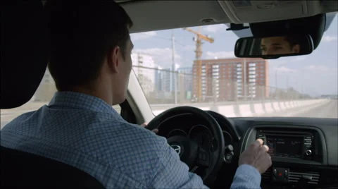 Young man drives fast on the highway and turns on the music Stock Footage 40737352
