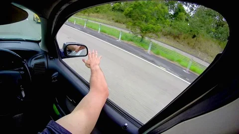 Young Man Driving, Arm Outside Window Stock Footage 70278659