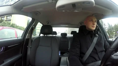 Young man driving a car Stock Footage 47584790