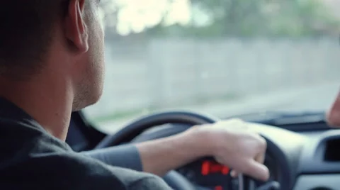 Young man driving a car Stock Footage 63392278