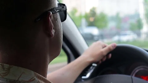 Young man driving a car Stock Footage 77404027