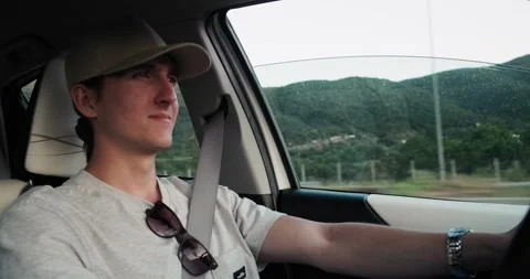 Young man driving car. Video stock 158330787
