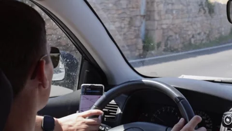 A young man is driving a car. Stock Footage 260581132