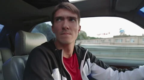 Young man driving a car. Inside shot Stock Footage 66682472