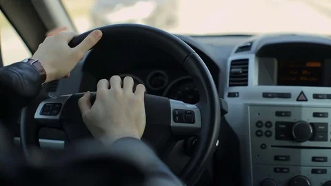 Young man driving a car. Inside shoot Stock Footage
