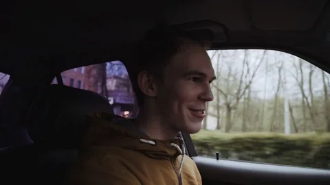 Young man driving a car. Inside shot Stock Footage 75565743