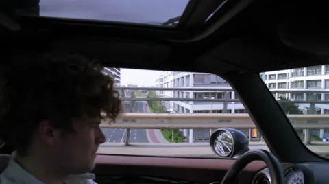 Young man driving on the highway Stock Footage 41544035