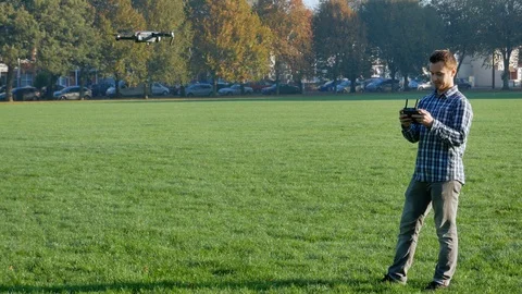 Young man with a drone in the park Video stock 97006700