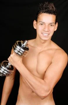Young man with dumbbell Stock Photos