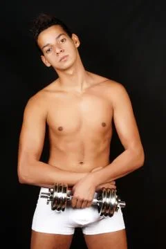 Young man with dumbbell Stock Photos