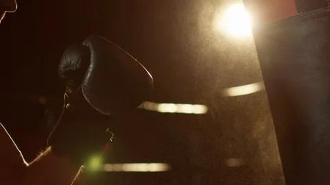 Young Man During The Boxing Training On The Dark Background Hitting The Punching Stock Footage 112600252