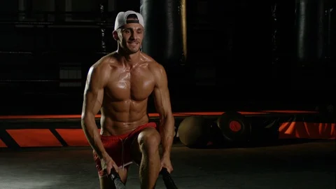 Young Man During The Boxing Training On The Dark Background Warming Up With The Video stock 112602928