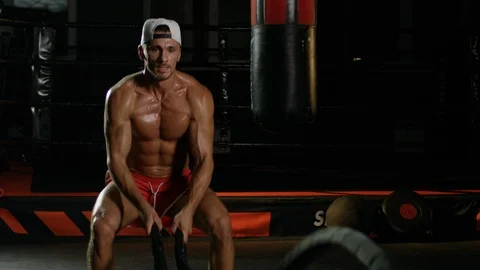 Young Man During The Boxing Training On The Dark Background Warming Up With The Stock Footage 112603326