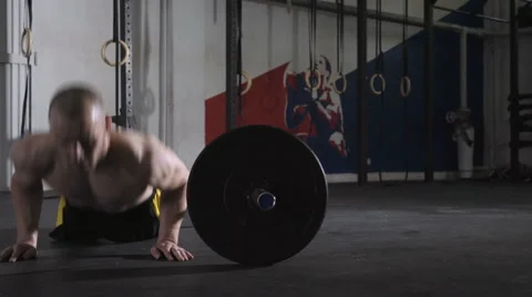 Young man during intense workout doing burpees over the bar Stock Footage 65280295