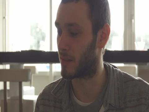 Young Man eat at Restaurant Stock Footage 73376564