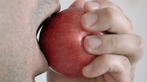Young man eating an apple 動画素材 41966601