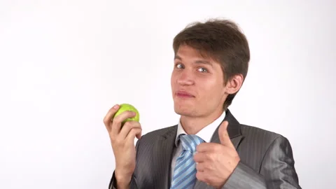 Young man eating an apple Stock-Footage 92776756