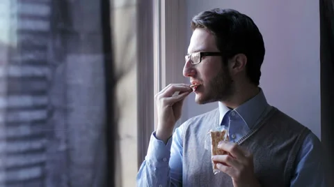 Young man eating craker Stock Footage 35164096