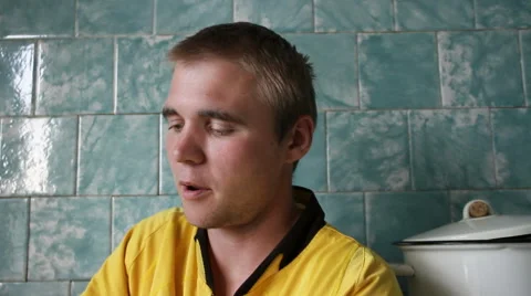 Young man eating. Stockbeeldmateriaal 40728217