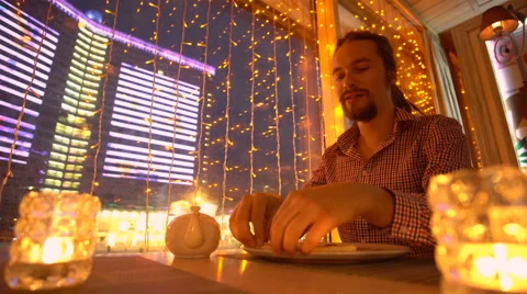 A young man is eating a pizza Stock Footage 65080627