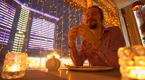 A young man is eating a pizza Stock Footage 65155266
