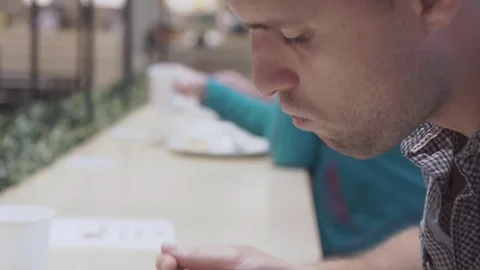 Young man eating in restaurant. Stock Footage 78982461