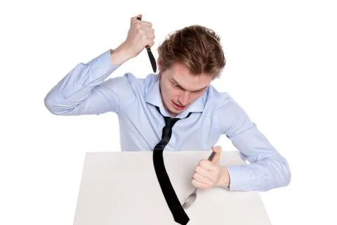 Young man eats his necktie Stock Photos