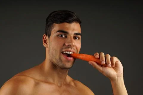Young man eats Stock Photos