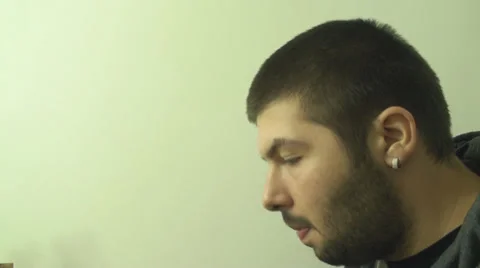 Young Man Eats Some Crispy Onion Rings Side Shot Stock Footage 33660411