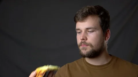 A young man eats a very tasty pizza Stock-Footage 124503540