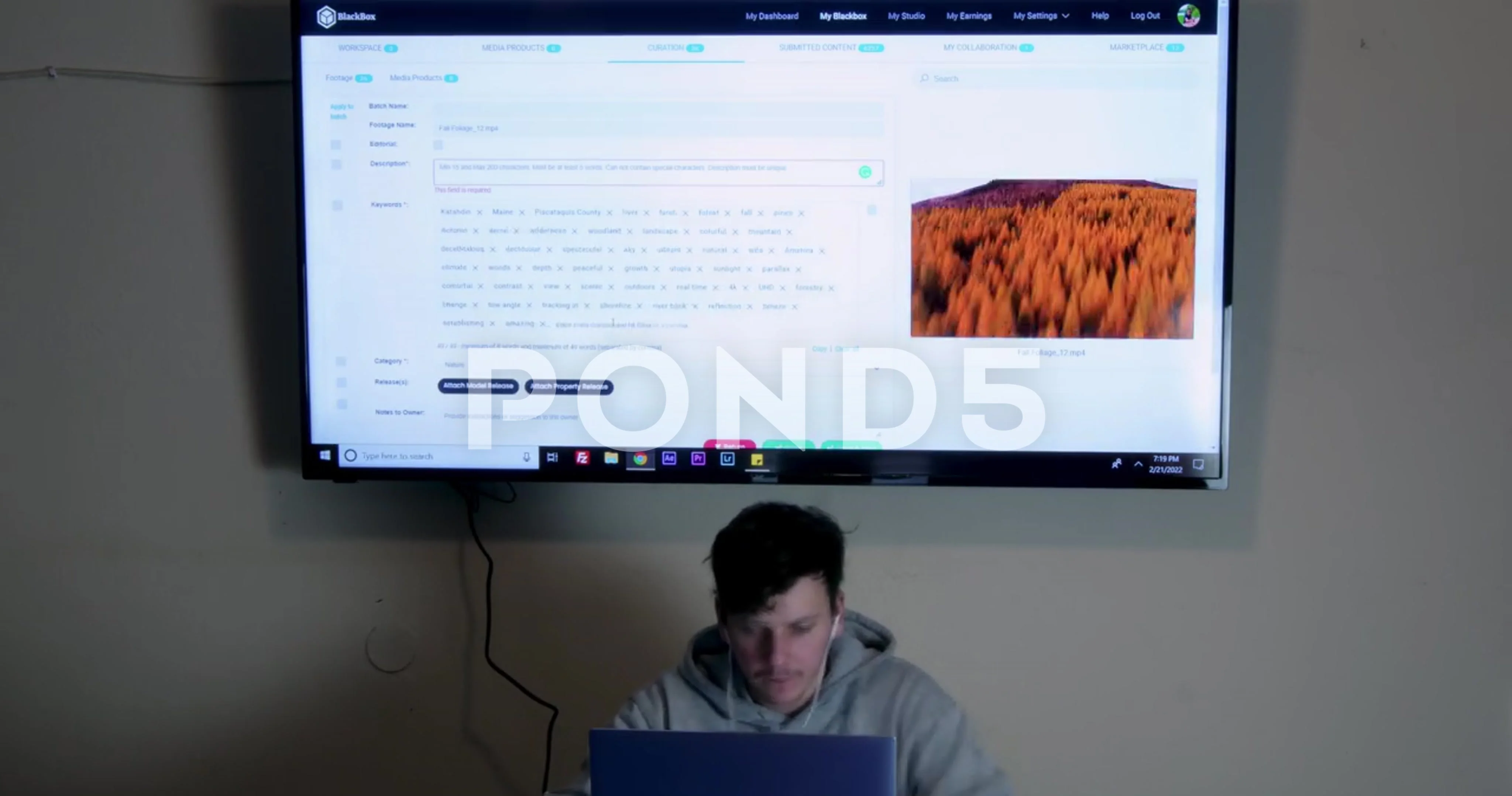 Young man editing stock video footage online passive income Timelapse