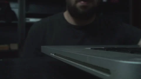 Young Man Ejects The DVD Into His Laptop Front-Shot Stock Footage 34045829