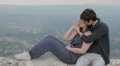 young man embraces and kisses beautiful young woman HD Footage