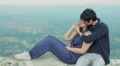 young man embraces and kisses beautiful young woman HD Footage