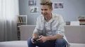 Young man emotionally reacting controlling his character playing video games HD Footage