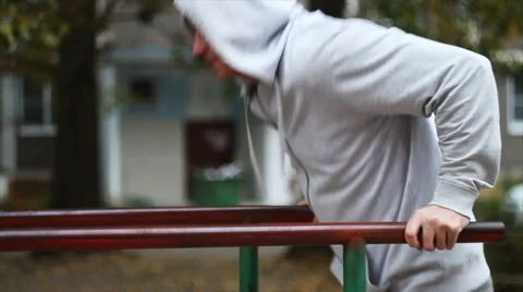 The young man is engaged on the bars Stock Footage 68207828