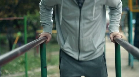 The young man is engaged on the bars Stock Footage 68207884