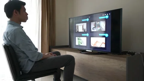 Young Man Engaged with Smart Home Technology Stock Footage 314899229