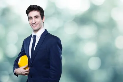 Young man engineer in helmet on background Stock Photos
