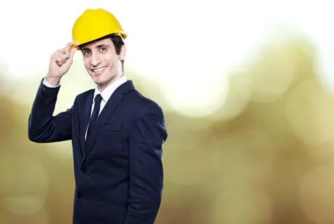 Young man engineer in helmet on background Stock Photos