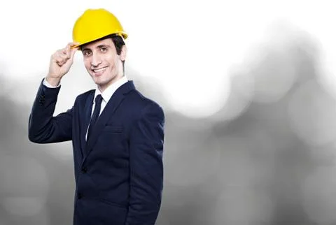 Young man engineer in helmet on background Stock Photos
