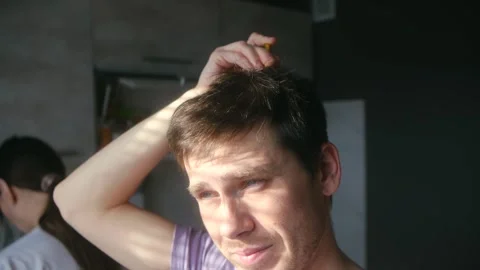 Young man enjoying a relaxing head massage at home Stock-Footage 337828615
